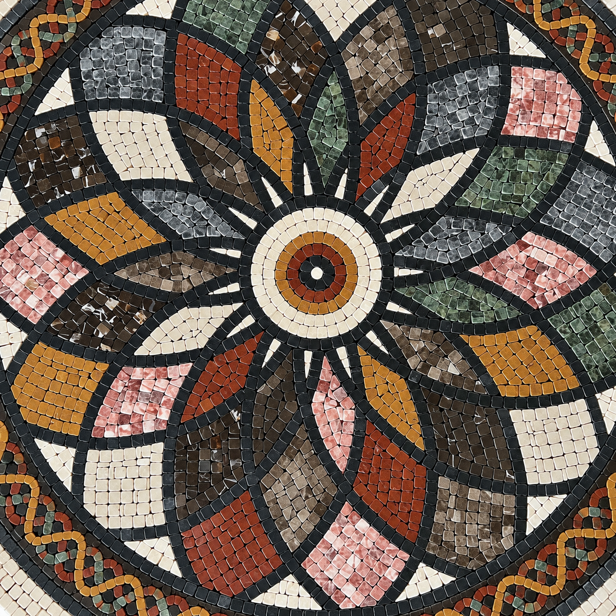 Close-up of round stone mosaic floral rosette with multicolor tiles around a center medallion