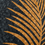 Close-up round mosaic showing black tiles with curved gold palm frond stripes.