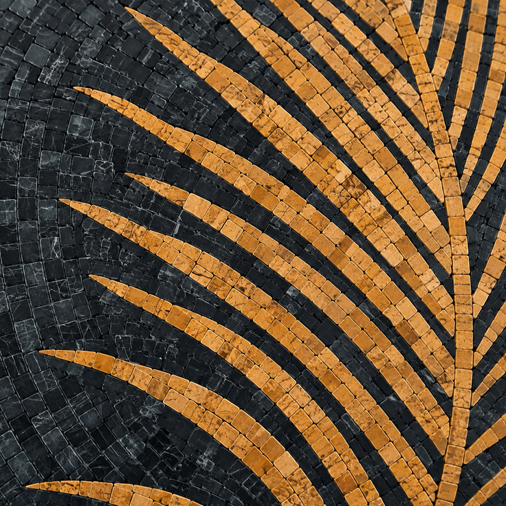 Close-up round mosaic showing black tiles with curved gold palm frond stripes.
