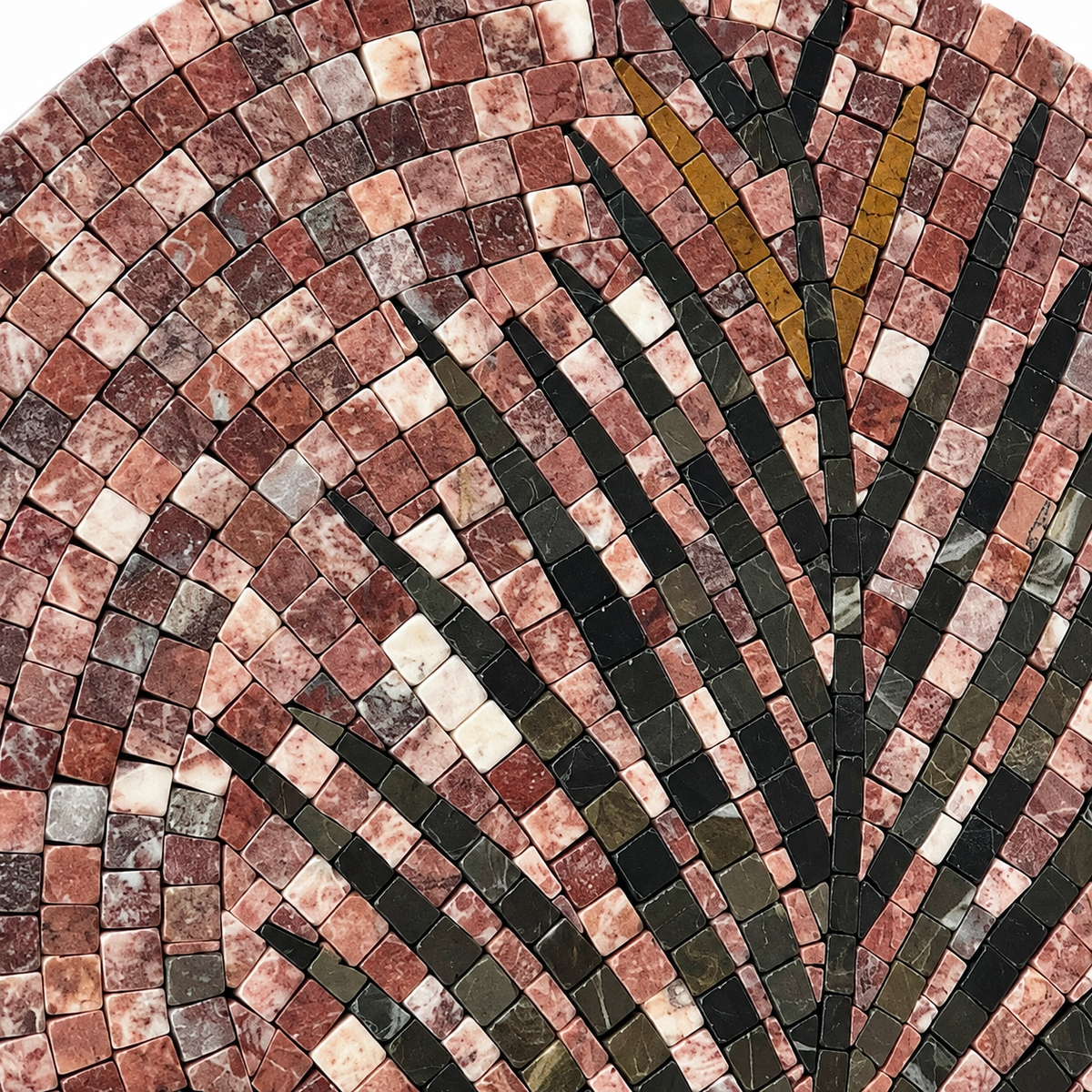 Palm frond stone mosaic detail with reddish, cream, and dark tile stripes