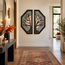 Two octagonal stone mosaic wall arts with leaf-branch design, blue-gray stone and tan highlights