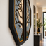 Octagonal stone mosaic wall art with blue-gray and tan branch design in dark frame