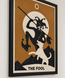 Close-up of framed amber mosaic wall art with a tarot figure and “THE FOOL” banner.
