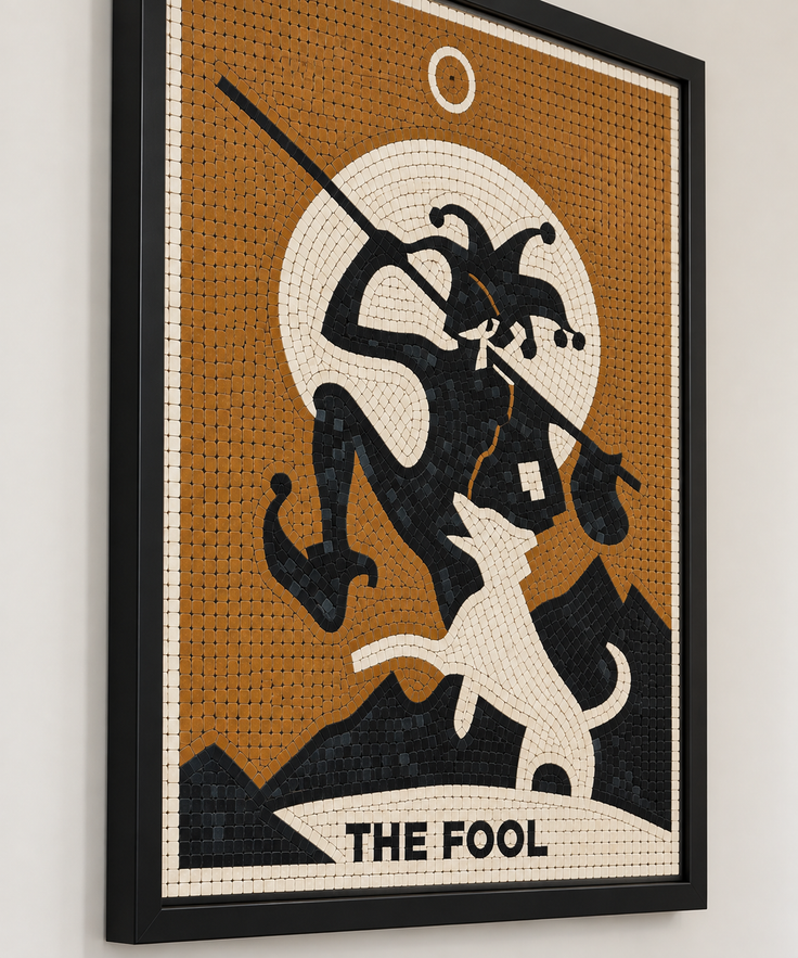 Close-up of framed amber mosaic wall art with a tarot figure and “THE FOOL” banner.