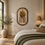 Handmade stone mosaic wall art, arched design with gold reeds, dark leaves, and striped base