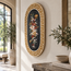Oval floral mosaic wall hanging with Greek key border and red, green, beige figures.