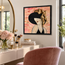 Framed mosaic portrait of a woman with a gold hat, black headpiece, brick-style background