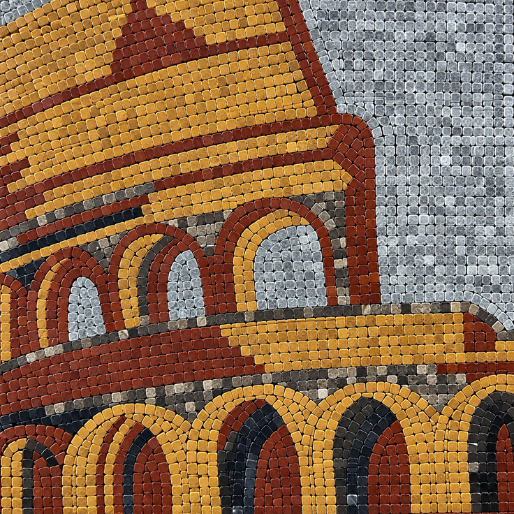 Close-up mosaic wall art detail with arched shapes in gold, red, and gray tiles