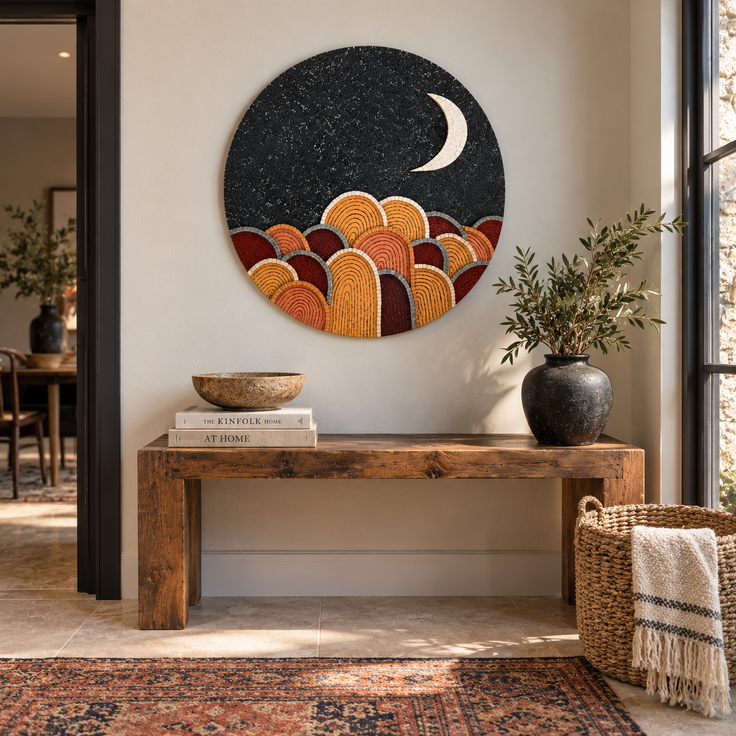 Round black mosaic wall disc with crescent moon and multicolored arched mountain pattern