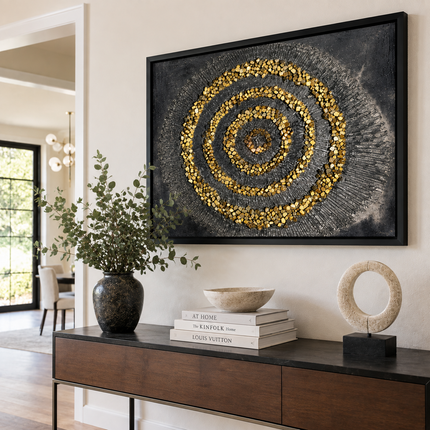 Framed spiral mandala mosaic with gold and white beadwork on dark textured canvas.