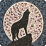 Close-up mosaic wall art: wolf howling design in black, white, and gray tiles