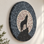 Oval wolf howling moon mosaic wall art in gray, black, and white tile